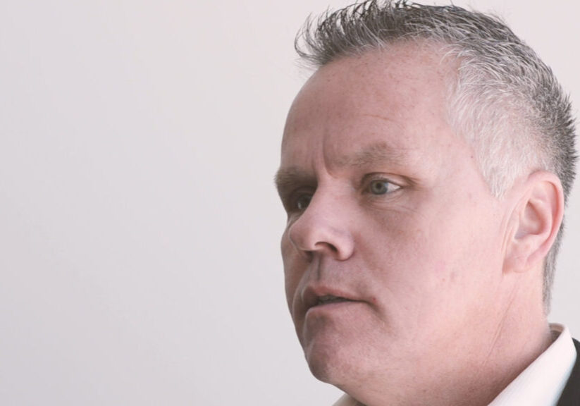 man with short gray hair