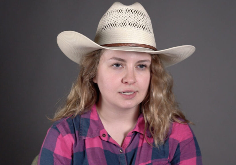 woman with long hair in a cowboy hat