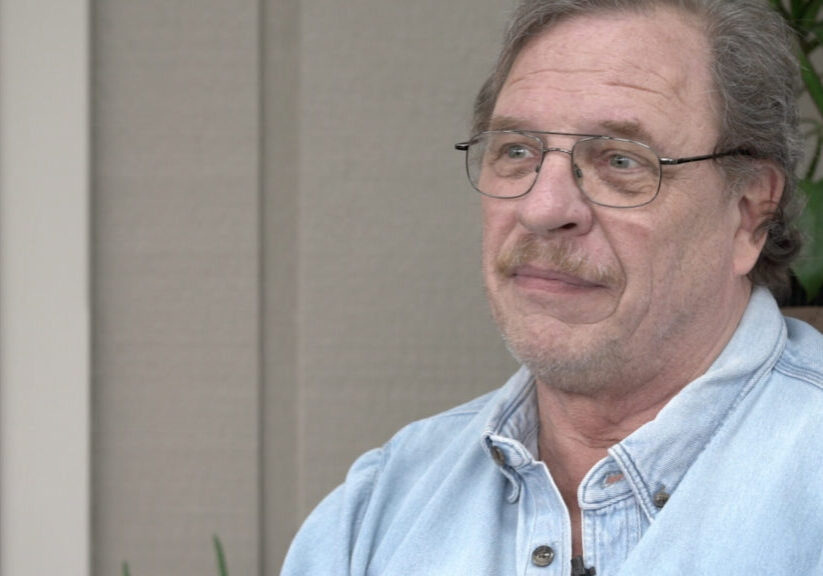 man in denim shirt